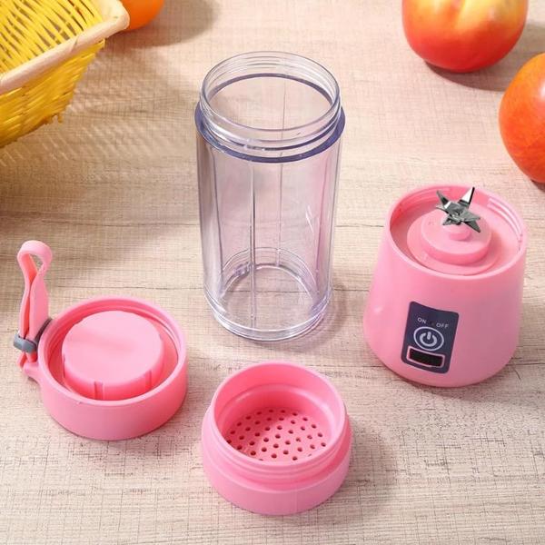 Person enjoying freshly blended drink from portable blender